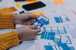 A person is working on a project with a piece of paper photo