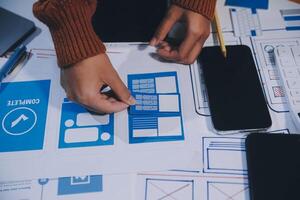 A person is working on a mobile app design photo