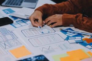 A person is working on a mobile app design photo