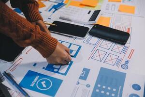 A person is working on a design project on a table photo