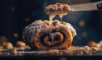 A piece of cinnamon roll with icing on it photo