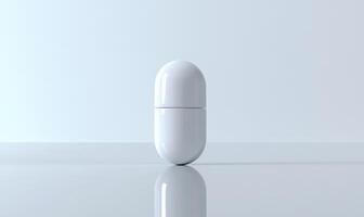 white pill on a table with a reflection photo