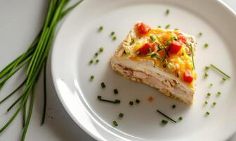 A slice of food with a green herb on top photo