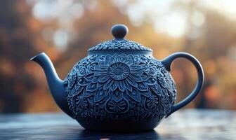 a teapot with intricate designs on it photo
