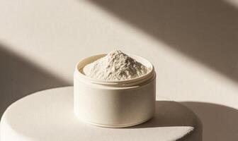 A white container with a white powder inside photo
