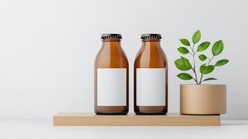 Two bottles of beer with a plant in a pot in between them photo
