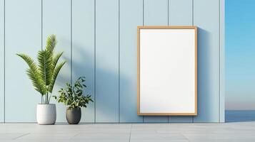 A white framed picture is on a wall next to two potted plants photo