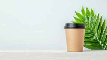 A coffee cup sits on a table next to a leaf photo