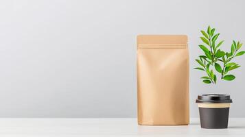 A brown paper bag with a plant in a cup next to it photo