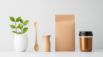 A white vase with a green leaf sits on a table next to a brown box photo