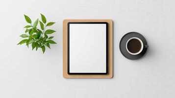 A tablet sits on a wooden stand next to a cup of coffee and a potted plant photo