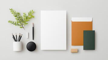 A white piece of paper sits on a table with a pen, pencil photo