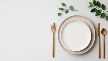 A white plate with a fork and knife on it photo