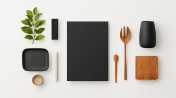 A black square with a white border and a spoon and fork on top of it photo