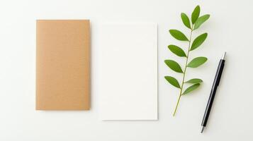 A notebook and pen are on a table with a leaf photo