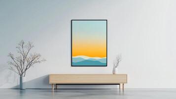 A framed painting of a mountain range with a blue sky and a yellow sun photo