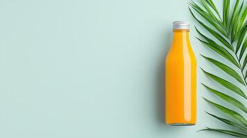 A bottle of orange juice is on a green background photo