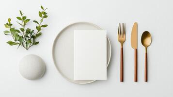 A minimal white plate with a fork, knife, and spoon on it photo