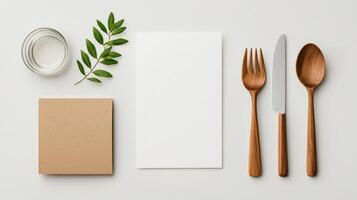 A white paper with a fork, knife and spoon on it photo