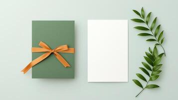 A green card with a yellow ribbon sits next to a white card photo