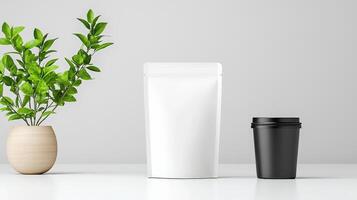A white and black container sits on a table next to a potted plant photo