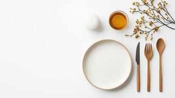 A white plate with a knife and spoon on it photo