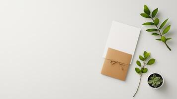 The envelope is tied with a string, and the plant is placed in a small pot photo