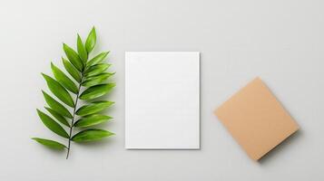A white piece of paper with a leaf on top of it photo