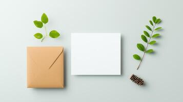 A white card with a brown envelope on top of it photo