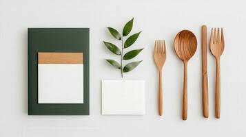 A white card with a green border and a leaf on it sits on top of a green card photo