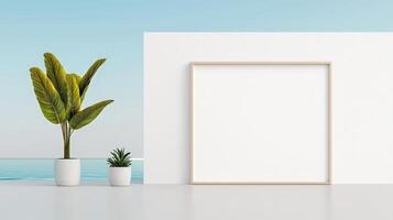 A white frame with a plant in it is on a white wall photo