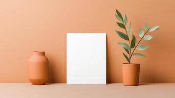 A white frame sits on a table next to two vases photo