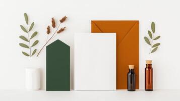 A white envelope, a green envelope, and two bottles of oil photo