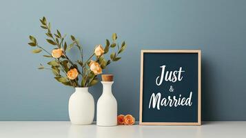 A vase with flowers and a sign that says Just Married on it photo