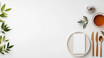 A white plate with a napkin and a knife and spoon on it photo