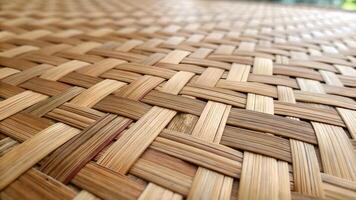 Woven Bamboo Mat Close Up Intricate Patterns Natural Tones Warm Inviting Texture Craftsmanship Design photo