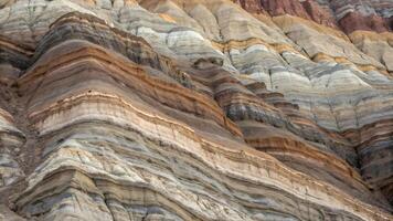 Natural Layered Rock Formation Close up Displaying Colorful Banded Sedimentary Strata and Textures photo