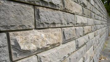 Rough Stone Wall Close up Gray Rectangular Blocks Horizontal Textures Natural Patterns Architecture Construction Design photo