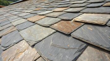 Textured Slate Roofing Pattern, Close Up View of Overlapping Tiles, Natural Color Variations on Building Exterior photo