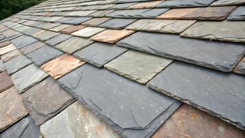 Textured Slate Roof Tiles Close Up Showing Overlapping Patterns and Natural Color Variations on a Sunny Day photo