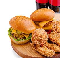 Delicious fast food spread with burgers and fried chicken photo