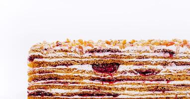 Layers of delicious dessert with raspberry filling and cream photo