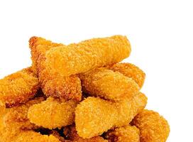 Crispy golden chicken bites stacked on a white background photo