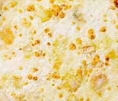Delicious cheesy dish topped with golden crust in a warm setting photo