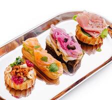 Delightful selection of gourmet canapes on a silver platter photo