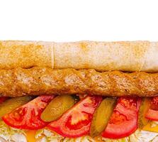 Delicious kebab wrap with fresh vegetables at midday photo