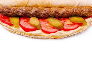 Delicious wrap filled with meat, vegetables, and sauce photo