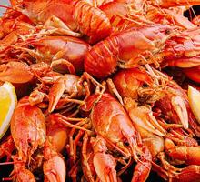 Freshly cooked crawfish served with lemon slices ready for a feast photo