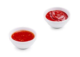 Two small bowls of sauces on a white background ready for dipping photo