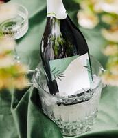 Refreshing champagne in ice bucket enhances elegant table setting photo